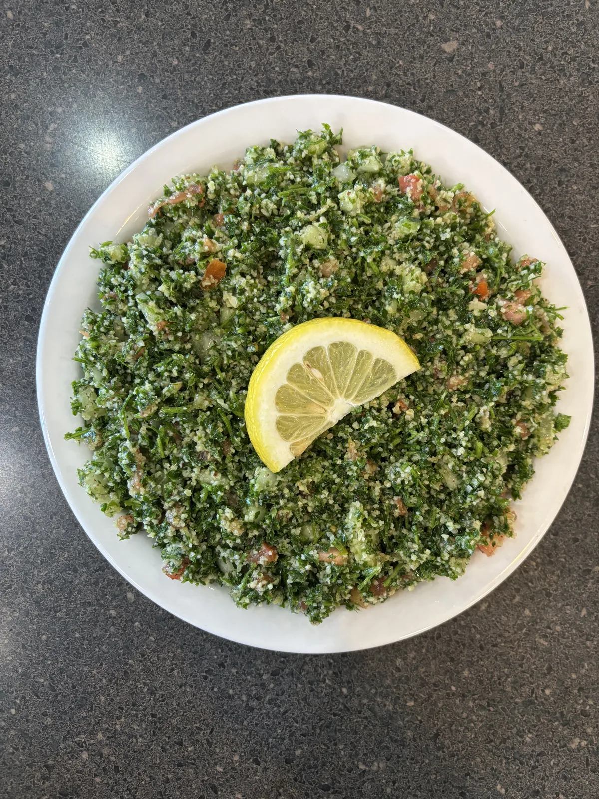 Traditional Lebanese dishes assortment. Chickpea Fatteh, Tabbouleh, Fattoush Salad, Hummus and various of appetizers. Flat layot, selective focus